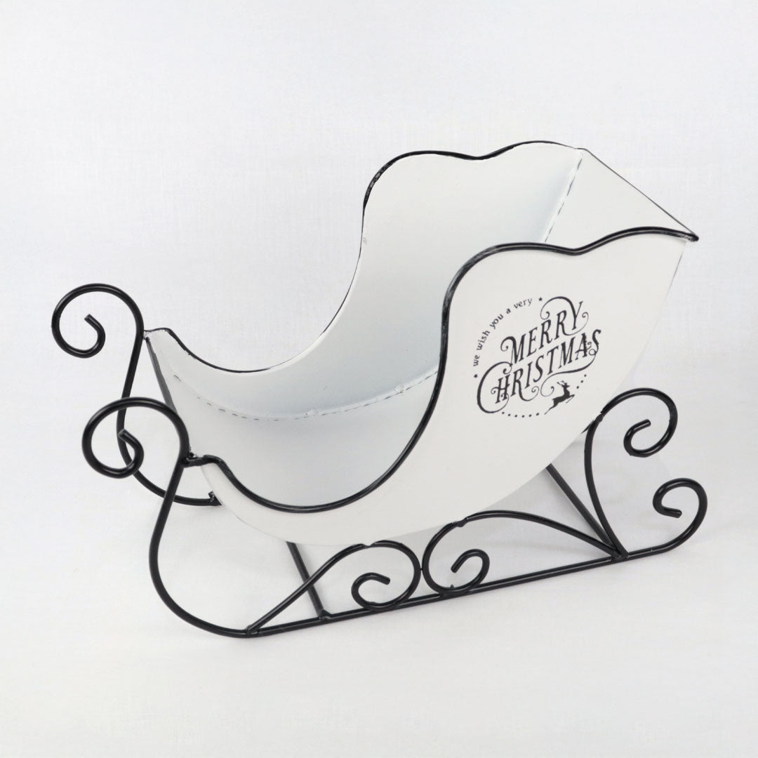 Trineo vintage de metal blanco